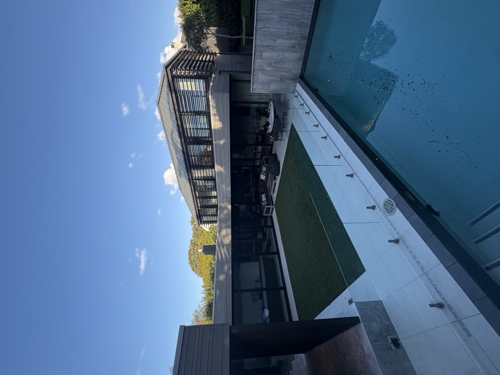 Aerial view of a pool and deck at an Auckland property